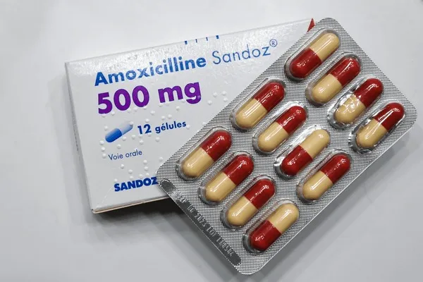 Amoxicillin A box and blister pack of Amoxicilline Sandoz 500 mg capsules, containing 12 capsules, an oral antibiotic used to treat bacterial infections.