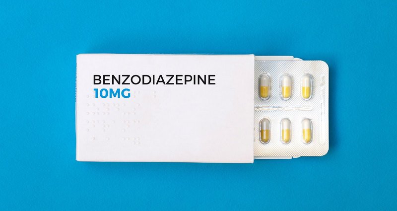 Benzodiazepines A white box of Benzodiazepine 10 mg with a blister pack showing yellow capsules, typically prescribed for anxiety, insomnia, or seizures.
