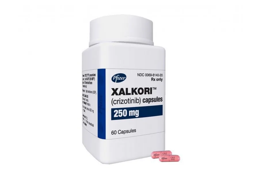A bottle of Pfizer Xalkori (crizotinib) 250 mg capsules, containing 60 capsules, used for specific types of lung cancer.