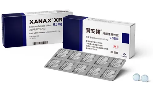 Two boxes of Xanax XR (Alprazolam) 0.5 mg extended-release tablets, one with English and one with Chinese labeling, showing a blister pack of tablets, used for treating anxiety and panic disorders.