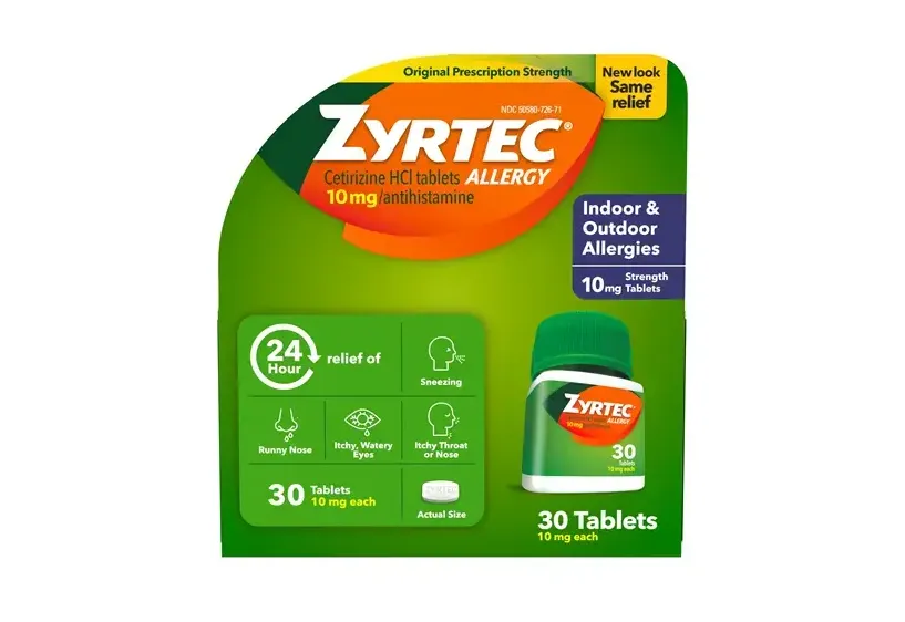 A green and orange package of Zyrtec Cetirizine HCl tablets 10 mg antihistamine, offering 24-hour relief for indoor and outdoor allergies, containing 30 tablets.