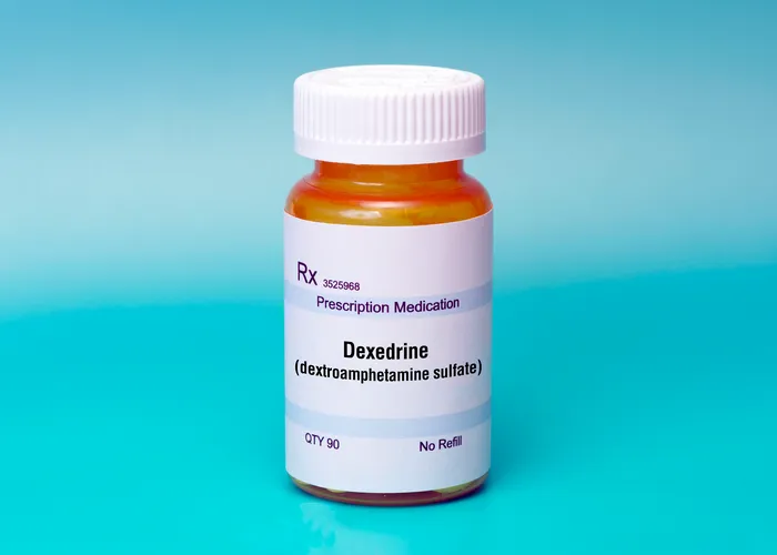 A bottle of Dexedrine (dextroamphetamine sulfate), a prescription medication, with a quantity of 90 tablets and no refills.