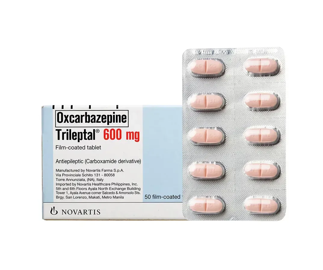 A box and a blister pack of Novartis Trileptal (Oxcarbazepine) 600 mg film-coated tablets, an antiepileptic.