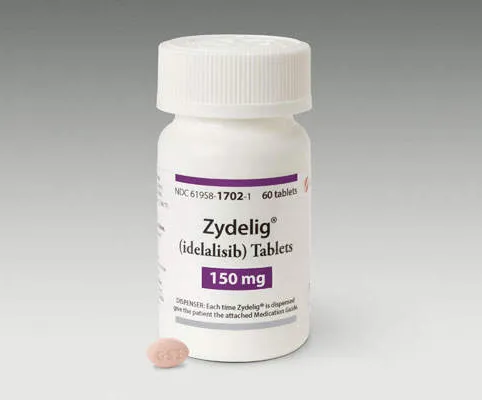 A bottle of Zydelig idelalisib 150 mg tablets, with one tablet visible outside the bottle.