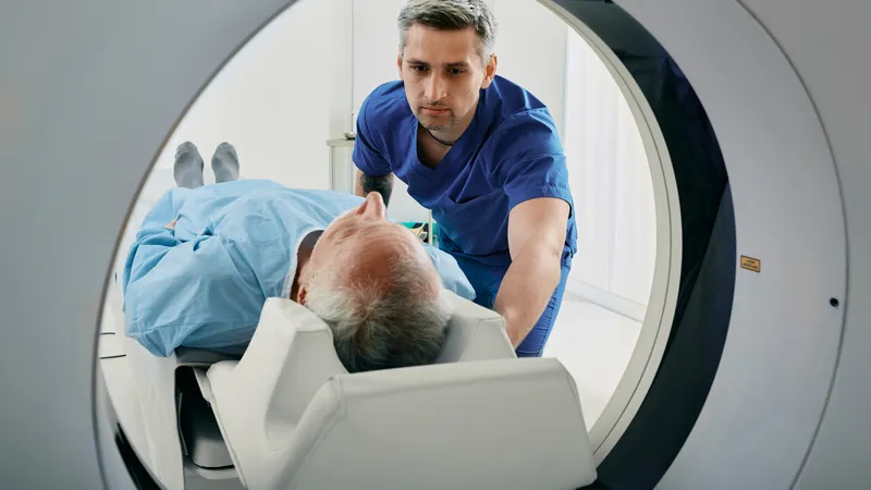 Doctor preparing an elderly patient for a chest CT scan to diagnose thymoma