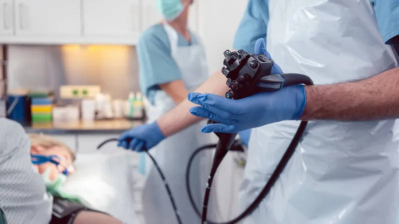 Doctor performing endoscopy to detect stomach lining abnormalities for cancer diagnosis