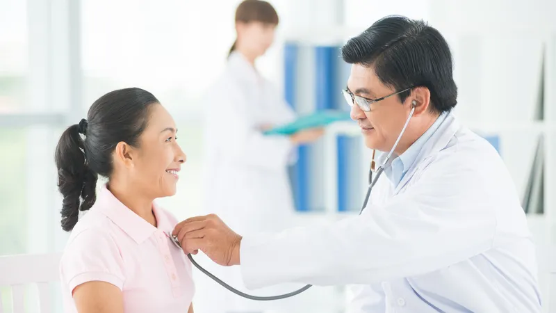 Doctor performing follow-up examination for a patient with thymoma