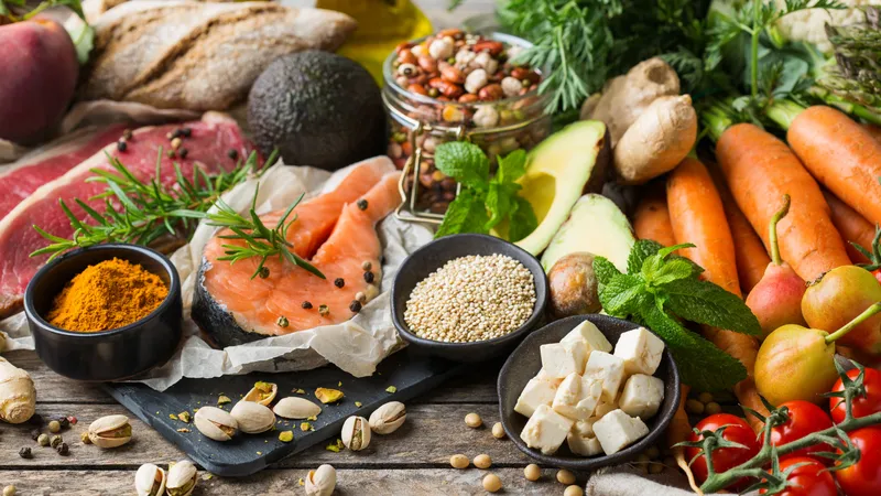 Urothelial Carcinoma Assorted healthy foods including salmon, vegetables, whole grains, and nuts to support overall wellness and urinary tract cancer prevention.