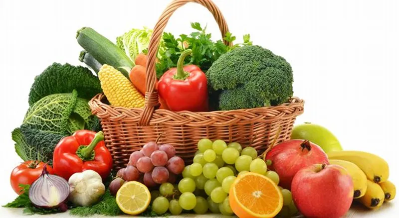 Stage 1 Colon Cancer Basket filled with fresh fruits and vegetables rich in fiber, providing protective benefits against colon cancer