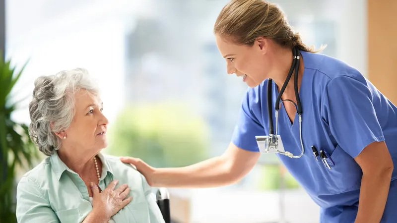 Elderly patient with meningioma receiving support and stress management advice from nurse
