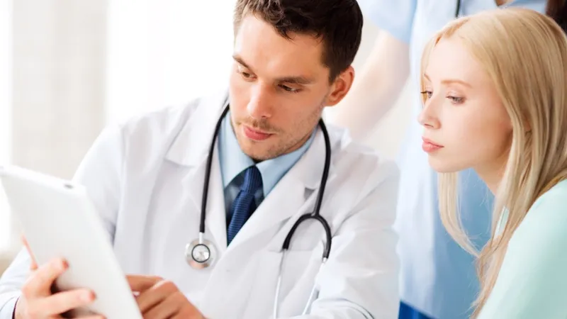 Doctor discussing chondrosarcoma condition and treatment options with a patient during a regular checkup