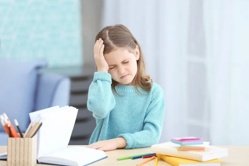 Medulloblastoma Child experiencing headache, a common symptom of medulloblastoma brain tumor