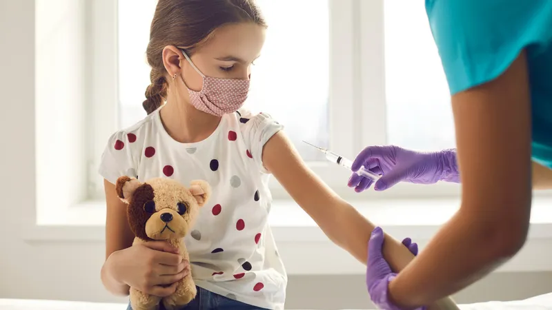 A child receiving vaccination to help prevent hemolytic anemia.