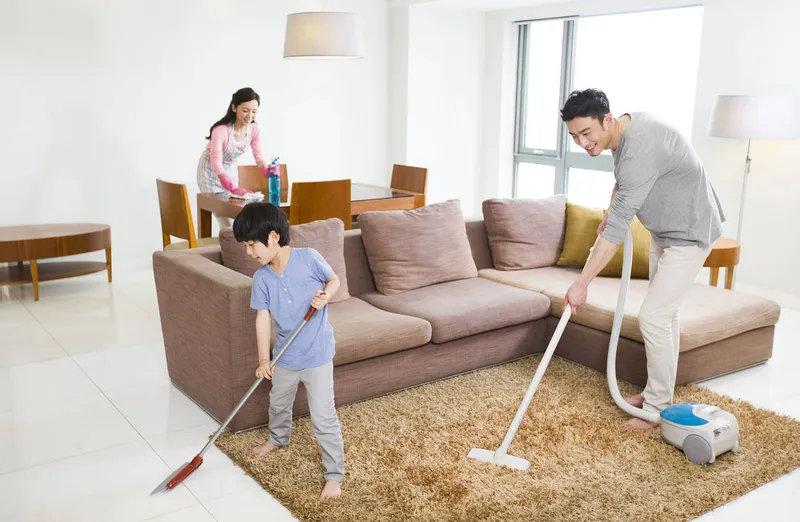 Family cleaning the house regularly to prevent scabies infestation