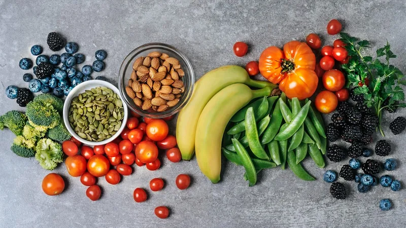 Assorted fresh fruits, vegetables, nuts, and seeds promoting a balanced diet for the prevention of ductal carcinoma in situ (DCIS)