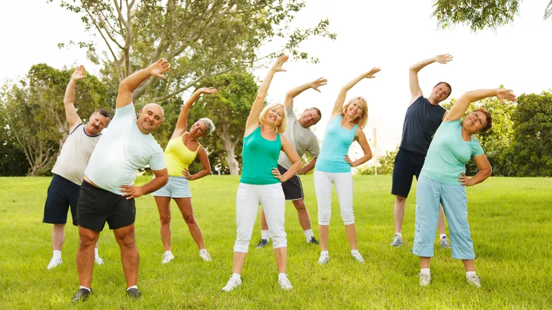Group of adults exercising outdoors to maintain healthy blood pressure levels