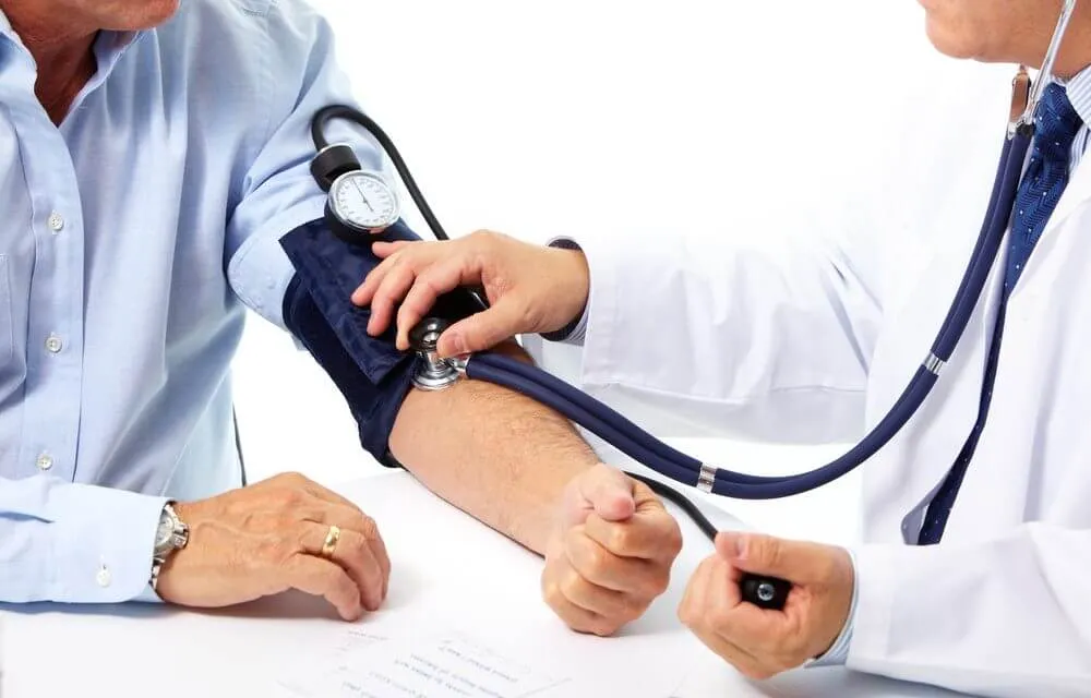 doctor measuring patient blood pressure hypertension leading to heart failure
