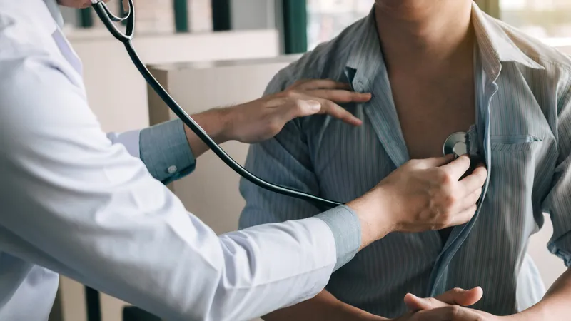 Heart Palpitations Doctor checking patient’s heartbeat; normal heart rate is 60–100 beats per minute